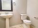 Bathroom with stand-alone sink and toilet at 19551 Timberbluff Dr, Land O Lakes, FL 34638