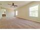 Bright bedroom with large windows and neutral carpet at 19551 Timberbluff Dr, Land O Lakes, FL 34638