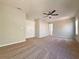 Spacious bedroom features a ceiling fan and large closet at 19551 Timberbluff Dr, Land O Lakes, FL 34638