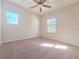 An empty bedroom featuring neutral carpet, and a ceiling fan at 19551 Timberbluff Dr, Land O Lakes, FL 34638