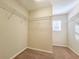 Walk-in closet with rod and shelf storage at 19551 Timberbluff Dr, Land O Lakes, FL 34638