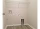 Neat laundry room with hookups and storage shelf at 19551 Timberbluff Dr, Land O Lakes, FL 34638