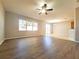A light-filled living space features wood floors and an open-concept design at 19551 Timberbluff Dr, Land O Lakes, FL 34638