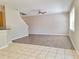 Open-concept living area features tile and laminate flooring at 19551 Timberbluff Dr, Land O Lakes, FL 34638