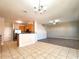 Open-concept living space with combined kitchen, dining, and living area at 19551 Timberbluff Dr, Land O Lakes, FL 34638