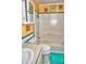 Bright bathroom featuring a toilet, tub, and single vanity at 20960 Little Magens Loop, Lutz, FL 33558