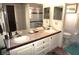 Bathroom featuring dual sinks and a toilet at 20960 Little Magens Loop, Lutz, FL 33558