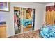 Large mirrored closet with clothes and accessories storage inside main bedroom at 20960 Little Magens Loop, Lutz, FL 33558