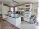 Bright kitchen featuring an island and stainless steel appliances at 20960 Little Magens Loop, Lutz, FL 33558