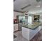 Charming kitchen with white cabinets and stainless steel appliances at 20960 Little Magens Loop, Lutz, FL 33558