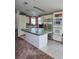 Bright kitchen featuring an island and stainless steel appliances at 20960 Little Magens Loop, Lutz, FL 33558
