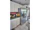 Traditional kitchen with stainless steel refrigerator and light colored cabinets at 20960 Little Magens Loop, Lutz, FL 33558