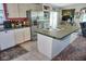 Charming kitchen with white cabinets and stainless steel appliances at 20960 Little Magens Loop, Lutz, FL 33558