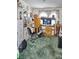 Living Room featuring a TV, exercise bike, and carpet at 20960 Little Magens Loop, Lutz, FL 33558