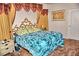 This is a large main bedroom featuring decorative headboard and curtains at 20960 Little Magens Loop, Lutz, FL 33558