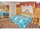 This is a main bedroom featuring a large mirror and decorative headboard at 20960 Little Magens Loop, Lutz, FL 33558