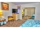 Cozy bedroom with seating area, TV, carpeted floor and large closet at 20960 Little Magens Loop, Lutz, FL 33558