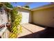 Exterior features a charming patio with lush plants and a brick-paved area, creating an inviting outdoor space at 20960 Little Magens Loop, Lutz, FL 33558