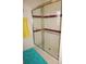Bathroom showing a tiled shower with glass doors and metal frame at 20960 Little Magens Loop, Lutz, FL 33558