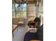 The sitting area offers chairs and natural light, creating a cozy spot at 20960 Little Magens Loop, Lutz, FL 33558