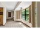 Bright dining area with tile flooring, offering views of the backyard through large windows and natural light at 2443 Glenridge Dr, Spring Hill, FL 34609