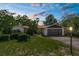 Charming single-story home featuring stone accents, a well-maintained lawn, and mature landscaping at 2443 Glenridge Dr, Spring Hill, FL 34609