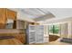 Functional kitchen featuring wooden cabinetry, matching countertops and appliances, and natural lighting at 2443 Glenridge Dr, Spring Hill, FL 34609