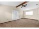 Living room with vaulted ceiling, ceiling fan, large windows and neutral colors at 2443 Glenridge Dr, Spring Hill, FL 34609