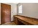 Office area with a wooden desk and door to closet at 2443 Glenridge Dr, Spring Hill, FL 34609