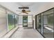 Enclosed patio featuring a ceiling fan, offering a versatile space for relaxation or entertaining at 2443 Glenridge Dr, Spring Hill, FL 34609