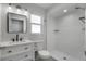 Modern bathroom features walk-in shower, sleek vanity with elegant countertop, and neutral color palette at 2866 Thistle N Ct, Palm Harbor, FL 34684