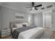 Inviting main bedroom with modern decor, wood-look floors, and ample natural light at 2866 Thistle N Ct, Palm Harbor, FL 34684