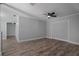 Spacious living room with sleek hardwood floors, light gray walls, and ample space for furniture arrangement at 2866 Thistle N Ct, Palm Harbor, FL 34684