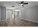 Open-concept living room featuring hardwood floors, neutral paint, and great natural lighting at 2866 Thistle N Ct, Palm Harbor, FL 34684