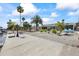 Waterfront property with a private dock, gravel landscaping, and mature trees at 3907 Headsail Dr, New Port Richey, FL 34652