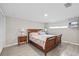 Cozy bedroom with wood-look tile flooring and ample natural light at 3907 Headsail Dr, New Port Richey, FL 34652