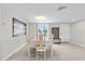 Bright dining room with large window and light wood floors at 3907 Headsail Dr, New Port Richey, FL 34652