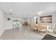 Open-concept dining area with views into the living area and breakfast bar at 3907 Headsail Dr, New Port Richey, FL 34652