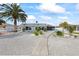 Charming single-story home with gravel yard and a pathway leading to the front door at 3907 Headsail Dr, New Port Richey, FL 34652