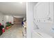 Laundry area is combined with the garage, featuring a stacked washer dryer at 3907 Headsail Dr, New Port Richey, FL 34652
