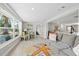 Bright living room with comfortable seating, modern decor, and views into the kitchen at 3907 Headsail Dr, New Port Richey, FL 34652