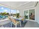 Relaxing screened-in patio with waterfront view and easy access to the living room at 3907 Headsail Dr, New Port Richey, FL 34652