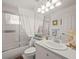 Clean and bright bathroom with a shower/tub, white vanity, and white decor at 4292 Tahiti Dr, Hernando Beach, FL 34607