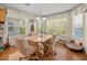 Cozy dining room with hardwood floors, natural light, and views of the water at 4292 Tahiti Dr, Hernando Beach, FL 34607