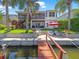 Beautiful home with a backyard oasis, featuring a patio, dock, and waterfront access at 4292 Tahiti Dr, Hernando Beach, FL 34607