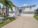 Stunning two-story home boasts a large driveway, two-car garage, and well-manicured landscaping at 4292 Tahiti Dr, Hernando Beach, FL 34607
