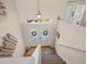 Bright foyer with beautiful doors, complemented by staircase and stylish decor at 4292 Tahiti Dr, Hernando Beach, FL 34607