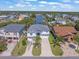 Charming home with a well-manicured front yard, three-car driveway, and lush landscaping at 4292 Tahiti Dr, Hernando Beach, FL 34607