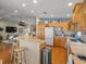 Bright kitchen with wooden cabinets, stainless steel appliances, a breakfast bar, and lots of counter space at 4292 Tahiti Dr, Hernando Beach, FL 34607
