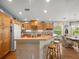 Bright kitchen featuring ample counter space, wooden cabinets, and adjacent dining area at 4292 Tahiti Dr, Hernando Beach, FL 34607